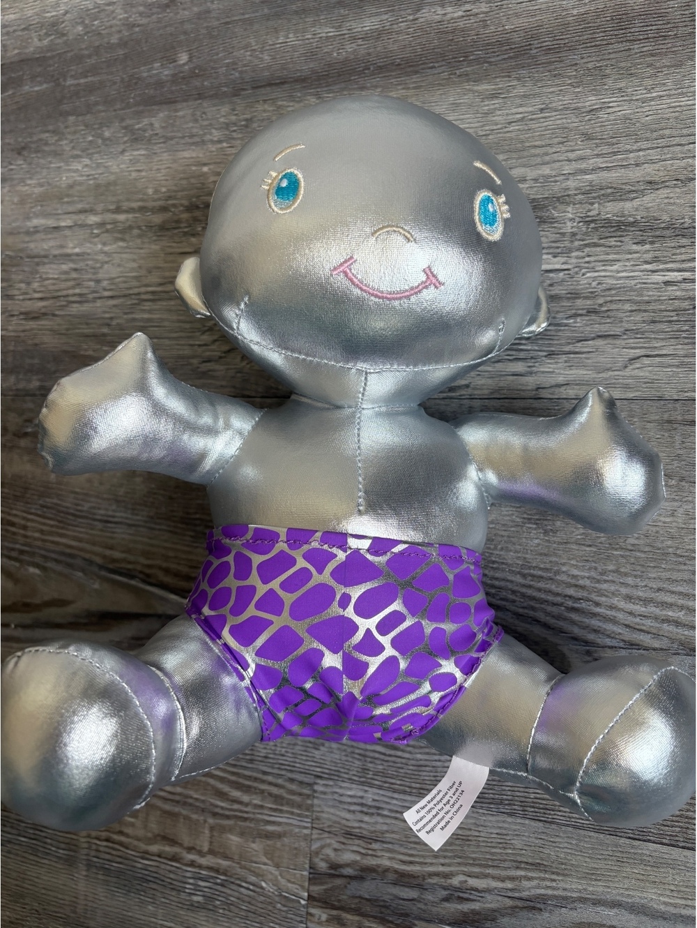 Krewe of IRIS King Cake Baby 2025 Silver Plush Doll with Purple Metallic Diaper